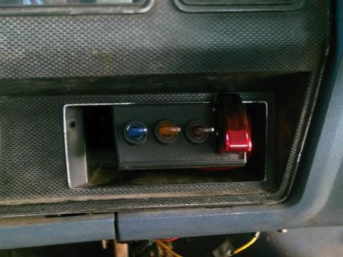 1986 Ford Bronco - Close-up view of a trailer hitch receiver and its components.