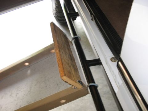 1995 Ford Bronco - A custom doggy ramp is installed inside a vehicle, likely for pet access.