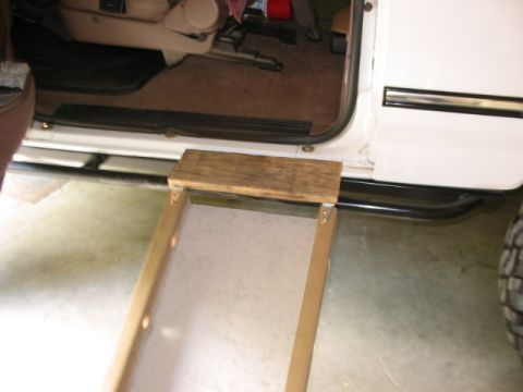 1995 Ford Bronco - Didn't want a doggy paw getting stuck between the slider railing and body, so I added a little folding step
