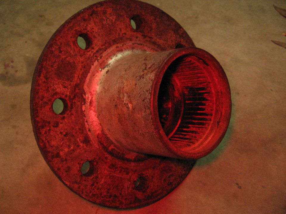 rusted wheel hub with splines and bolt holes