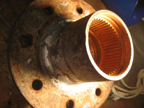 1974 Ford F-100 - Close-up of a rusty wheel hub, showing the splined interior.