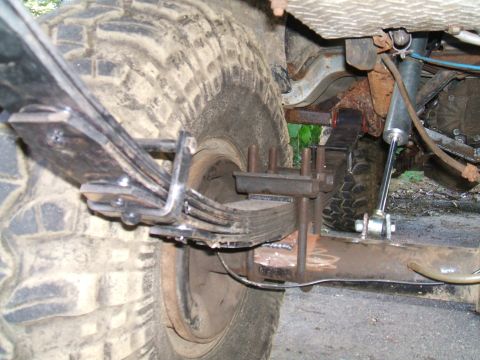 1995 Ford Bronco - Custom rear suspension modification showing leaf springs and shock absorber.