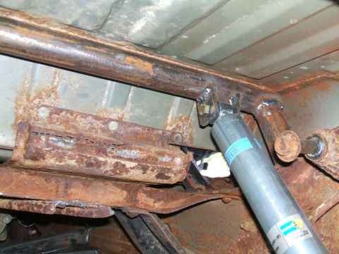 1995 Ford Bronco - Custom frame reinforcement and a new Bilstein shock absorber are visible on the underbody of this vehicle.