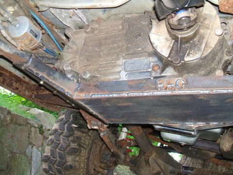 1995 Ford Bronco - Custom skid plate installed under the transfer case of an off-road vehicle.
