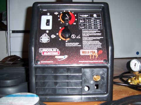 1983 Ford Bronco - A Lincoln Electric Weld Pak 175 welder is shown from the front, displaying its controls and branding.