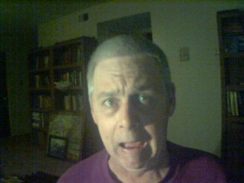 1979 Ford Bronco - A man's face fills the frame, his expression one of shock or surprise.