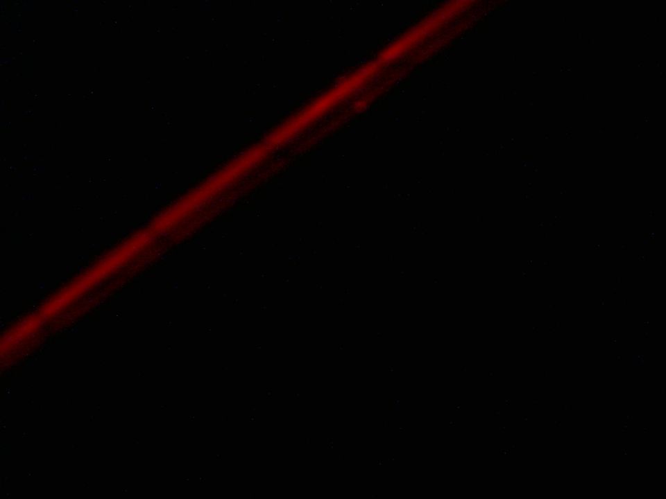 Diagonal red line on black background with SUPERMOTORS.NET watermark