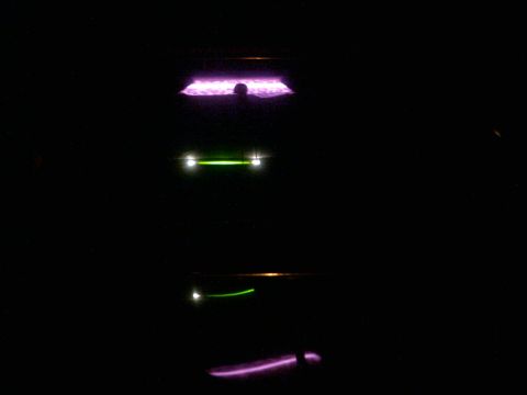 1985 Ford Crown Victoria LTD - Abstract view of car lights glowing in the dark, with visible text from a watermark.