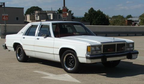 1985 Ford Crown Victoria LTD - This 1985 Ford Crown Victoria LTD is captured in a 3/4 front view, its classic sedan body style.