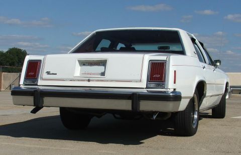 1985 Ford Crown Victoria LTD - Rear view of a white Ford sedan with a Virginia license plate, parked outdoors.