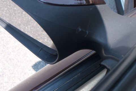2001 Ford Taurus - Scuff mark on the top of the rear view, I THINK this was a bolt with the nut still attached due to the pattern