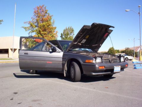 1986 Honda Accord - A gray 1986 Honda Accord is parked with its hood and driver's door open under a clear blue sky.