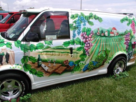 1978 Ford Mustang II - This van features a detailed mural depicting a vineyard landscape with grapes and a picnic setting.