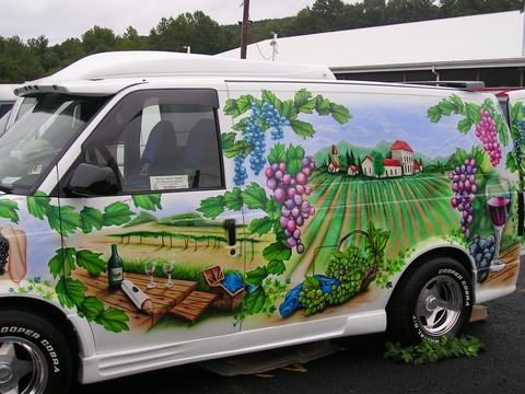1978 Ford Mustang II - This van is decorated with a vineyard mural, showing grapes, wine, and a picnic setting.