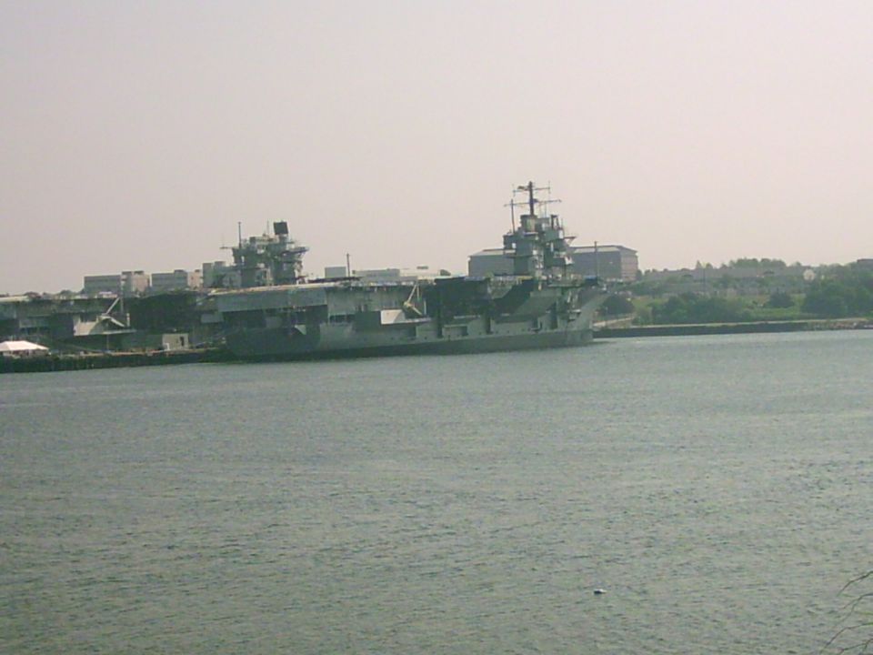 Aircraft carrier docked in harbor