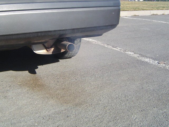 Rear bumper, exhaust pipe, and tire of a car