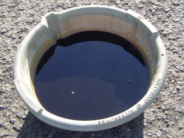 That is NOT motor oil! That is really old trans fluid. Never let your trans fluid get that dirty. Ever.