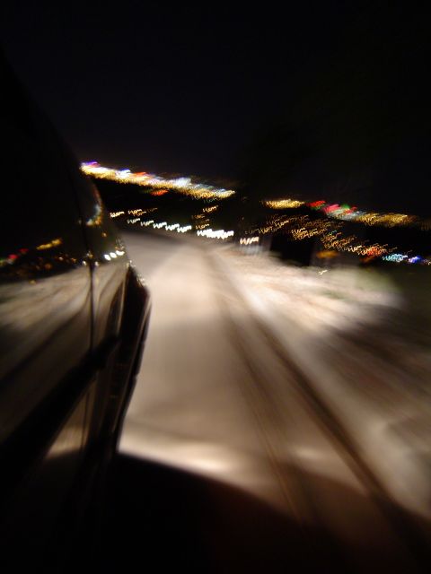 1986 Honda Accord - Night driving scene with city lights blurred in the background.