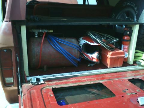 1978 Ford Bronco - Storage in the rear, and the on board air temp tank.