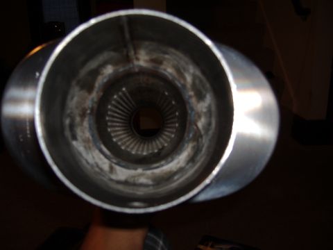 1998 Ford Taurus - Close-up view inside a muffler or exhaust pipe, showing internal baffles.