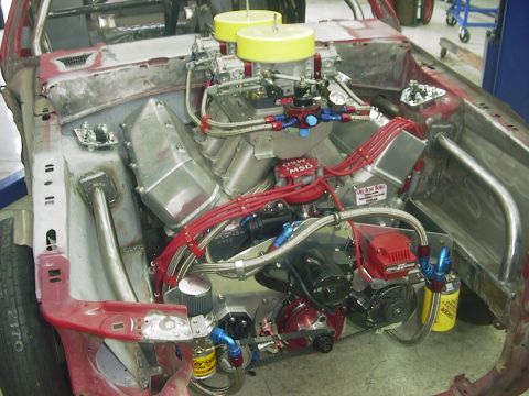 1990 Ford Mustang - Custom engine bay dual carburetors and MSD ignition components, likely for a race car.