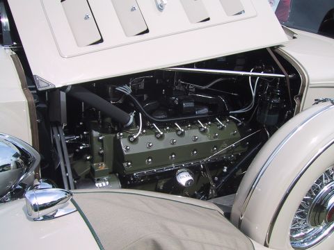 1968 Shelby GT500 - The engine bay of a classic car reveals a detailed view of its V8 engine and surrounding components.