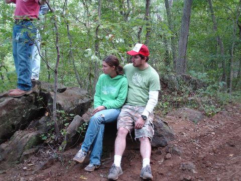 1996 Ford Bronco - A group of people are taking a break in a forest setting.