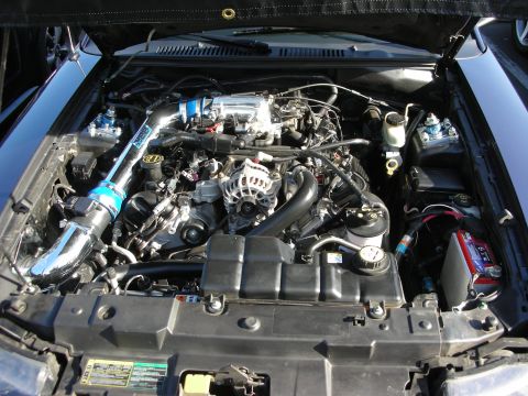 1992 Ford Crown Victoria - The engine compartment is open, revealing the motor and its components.