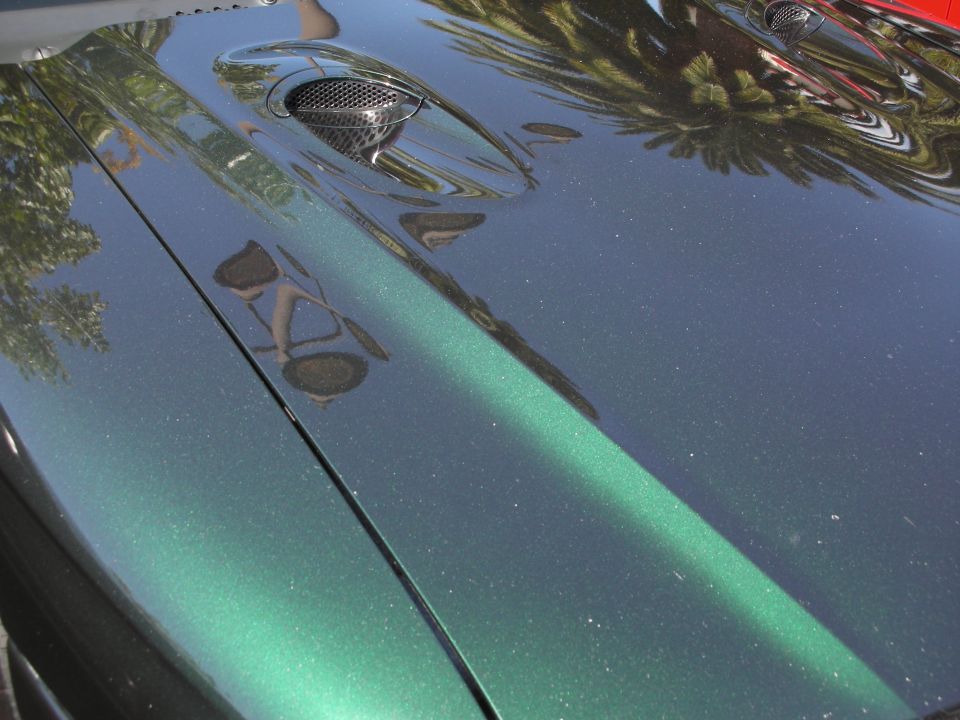 Green metallic hood with vents