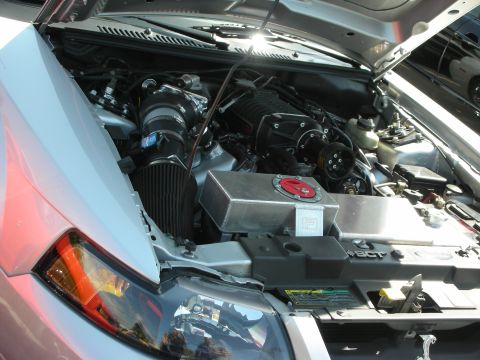 1992 Ford Crown Victoria - The engine bay features a prominent supercharger and custom modifications.