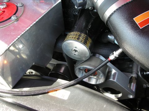 1992 Ford Crown Victoria - A detailed view of engine components, including belts and pulleys, with visible text on the belt.