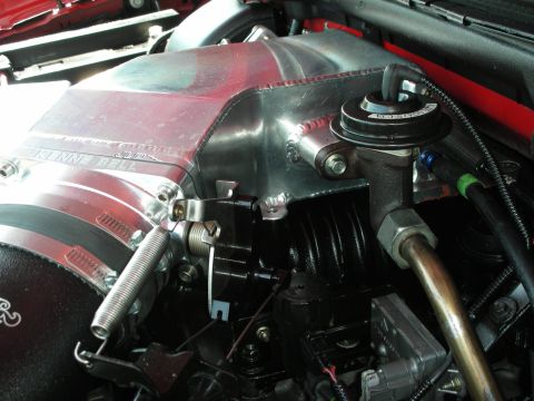 1992 Ford Crown Victoria - Close-up of an engine's intake manifold, a prominent KENNE-BELL logo and various engine parts.