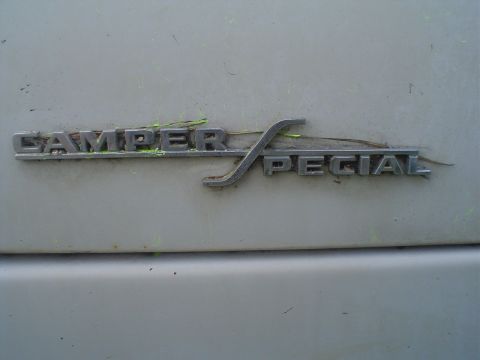 1967 Ford F-250 - Close-up of a Camper Special emblem on a vehicle's exterior.