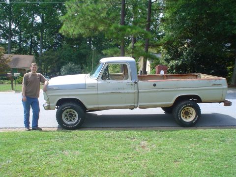 1967 Ford F-250 - A man poses with his 1967 Ford F-250 pickup truck.
