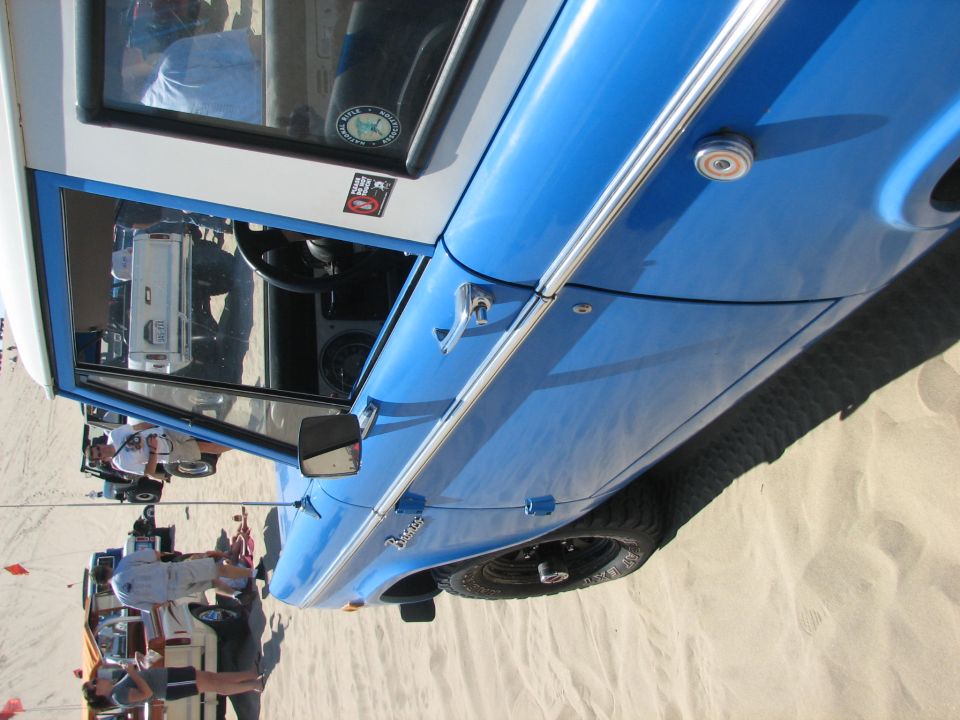 Blue and white early Bronco close-up of body side and fender (rotated)