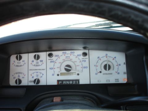 1996 Ford Bronco - Interior view of a vehicle's dashboard, the instrument cluster with various gauges and readouts.