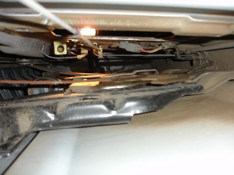 1996 Ford Bronco - Close-up of the internal tailgate latch mechanism, showing wires and metal components.