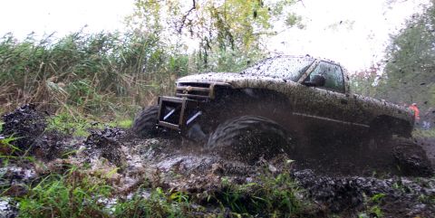 1978 Ford Bronco - Pickup truck stuck in mud during an off-road event.
