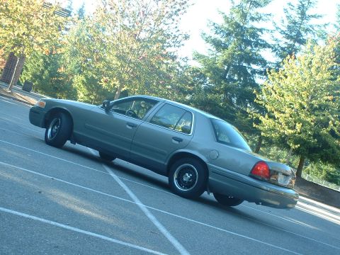 2000 Ford Crown Victoria - This 2000 Ford Crown Victoria sedan is captured from a 3q-front angle, its distinctive body style.