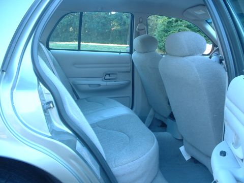 2000 Ford Crown Victoria - Rear interior view of a 2000 Ford Crown Victoria, showing the seats and door panel.