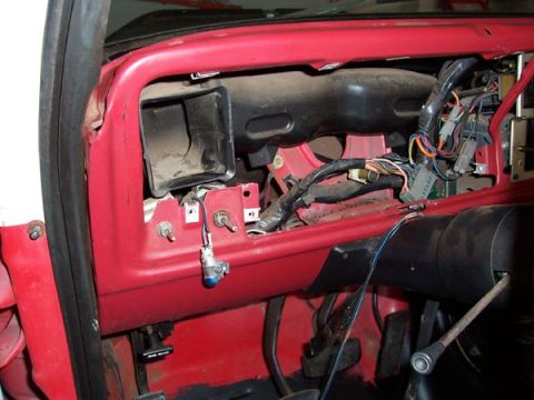1978 Ford Bronco - The dashboard of a 1978 Ford Bronco is disassembled, revealing wiring and ductwork.