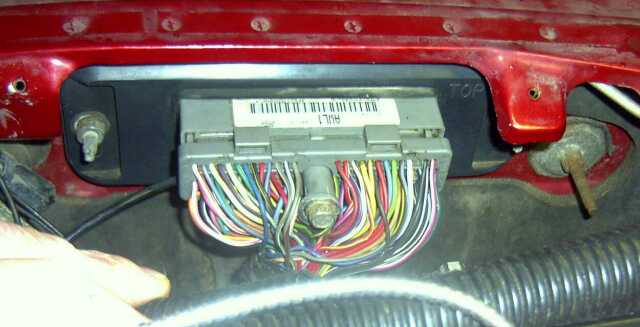 Engine control module with colorful wires and a label reading 'AUL1'