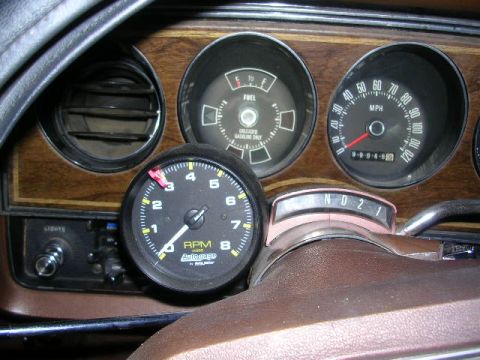 1975 Ford Ranchero - The interior of a 1975 Ford Ranchero displays its dashboard gauges, including the speedometer and RPM tachometer.