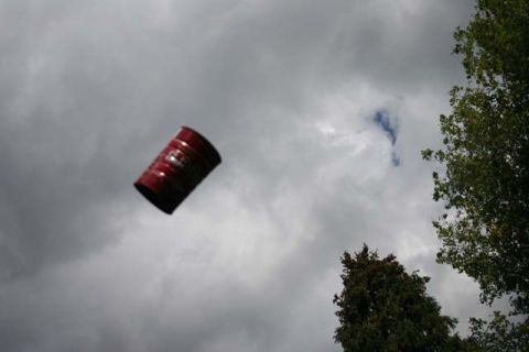 1987 Ford Bronco - A red barrel appears to be flying through the sky, with trees visible on the right side.