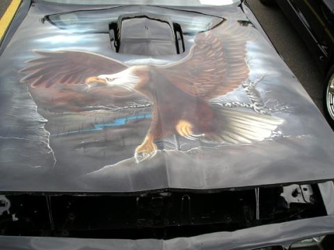 1994 Pontiac Trans Am - Custom airbrushed eagle design on the hood of a vehicle, with a "SUPERMOTORS" watermark visible.