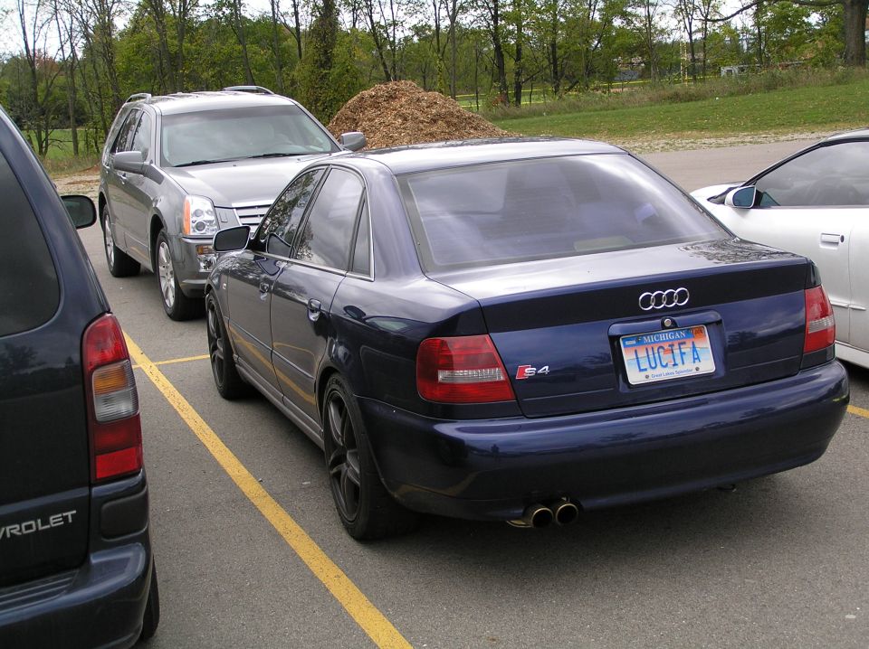 Dark blue Audi S4 sedan parked in a lot with Michigan plate reading LUCIFA