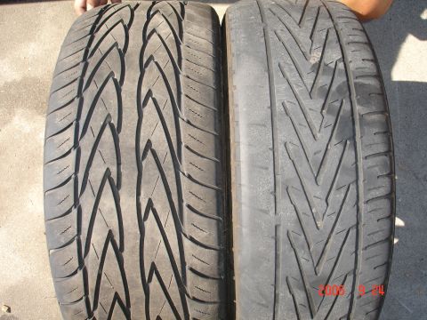 1993 Ford Taurus - A comparison of two different tire tread patterns, with a date stamp visible on the right tire.