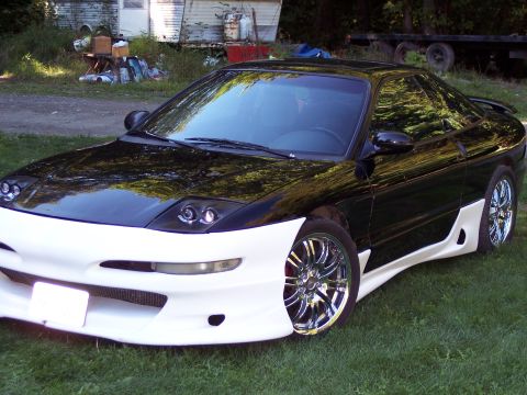 1996 Ford Probe - This 1996 Ford Probe features a striking black and white two-tone paint scheme and a custom body kit.