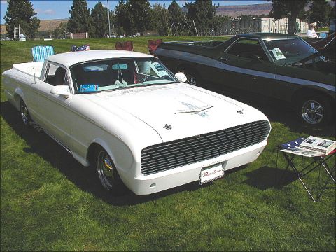 1967 Ford Ranchero - A white 1960 Ford Ranchero is displayed next to a darker vehicle at an outdoor event.