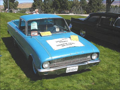 1967 Ford Ranchero - Blue 1960 Ford Falcon Ranchero parked on grass next to a black car.